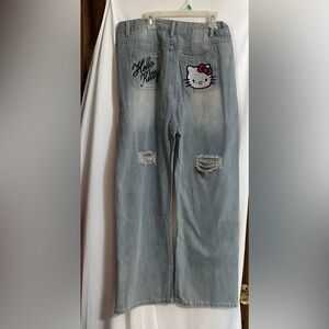 Hello Kitty: Embroidered back of light blue loose fit denim jeans. Street wear.